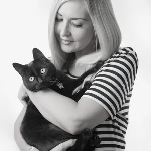 Faith-Lucy Smith holding a black cat